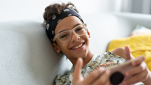 Teenager using smartphone.