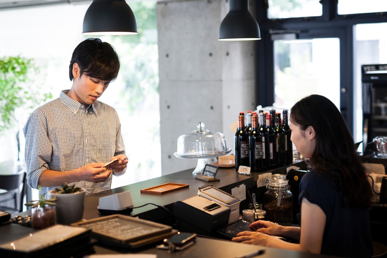 Man paying at counter