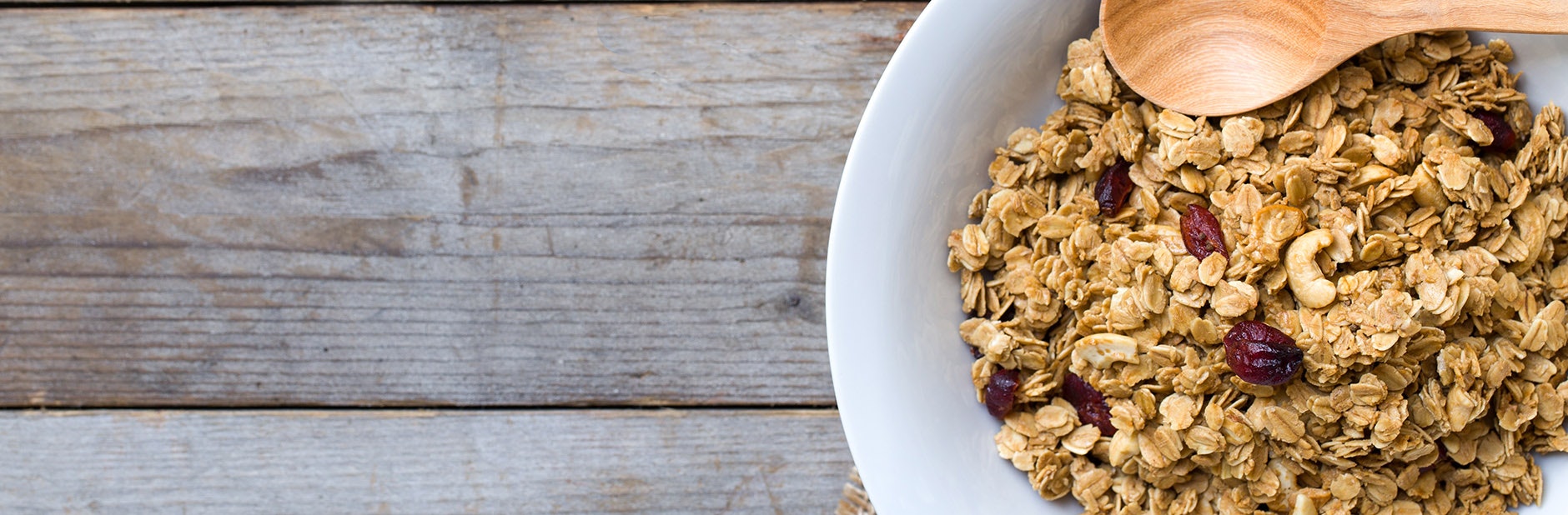 Bowl of muesli with wooden spoon