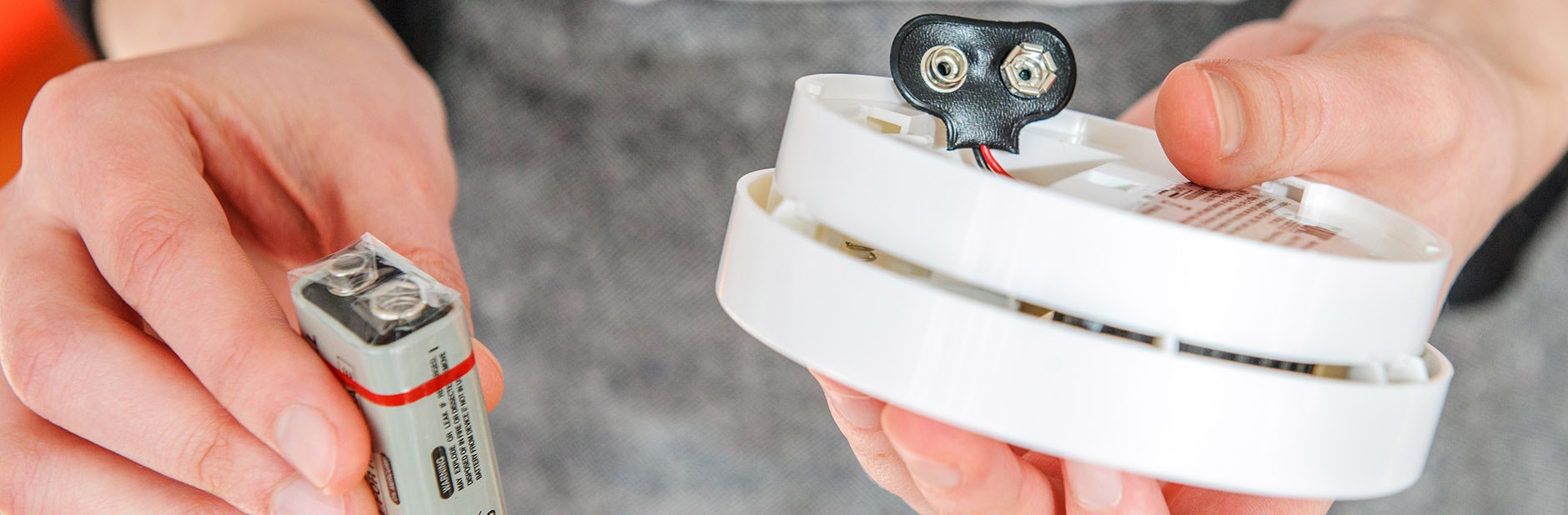 putting battery into smoke alarm