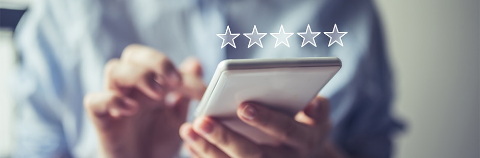 Writing an online review using a mobile phone.