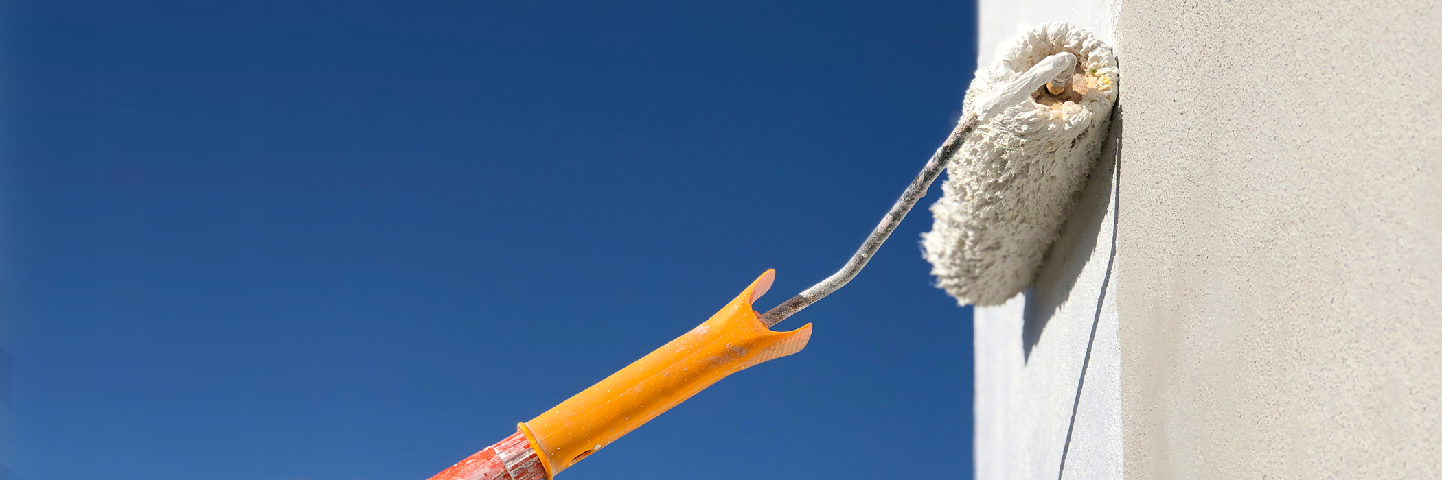 Close up of paint roller outdoors.