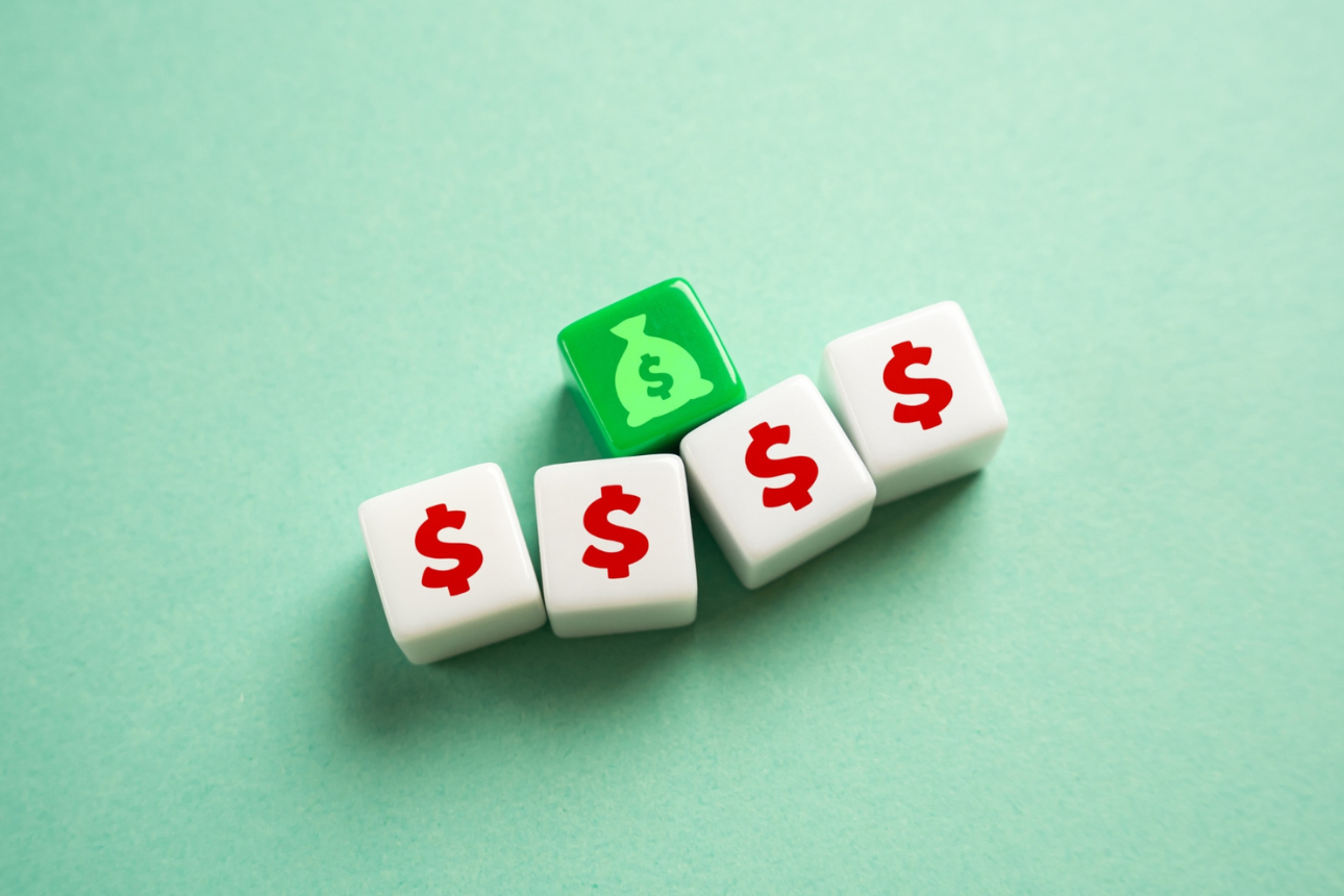 Dice with money icons on them.