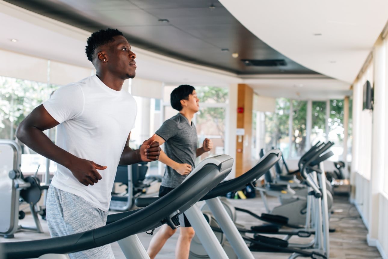 Image of men running on a treadmill
