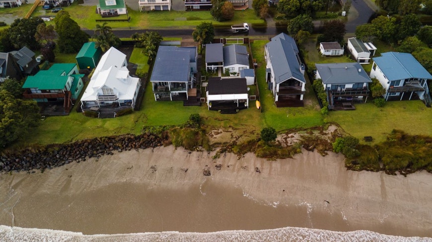 Image of a car driving through floods