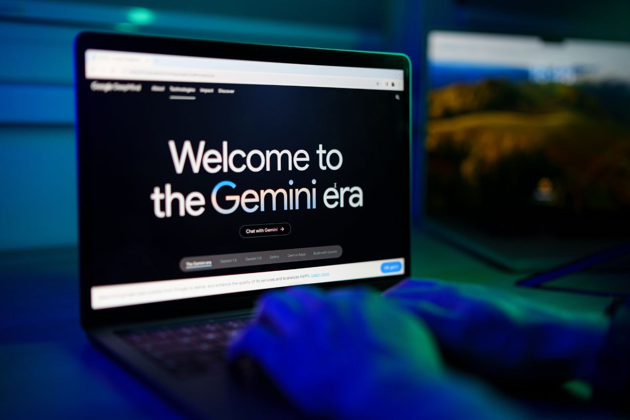 Close-up of man chatting with google Gemini Artificial intelligence Chatbot on computer