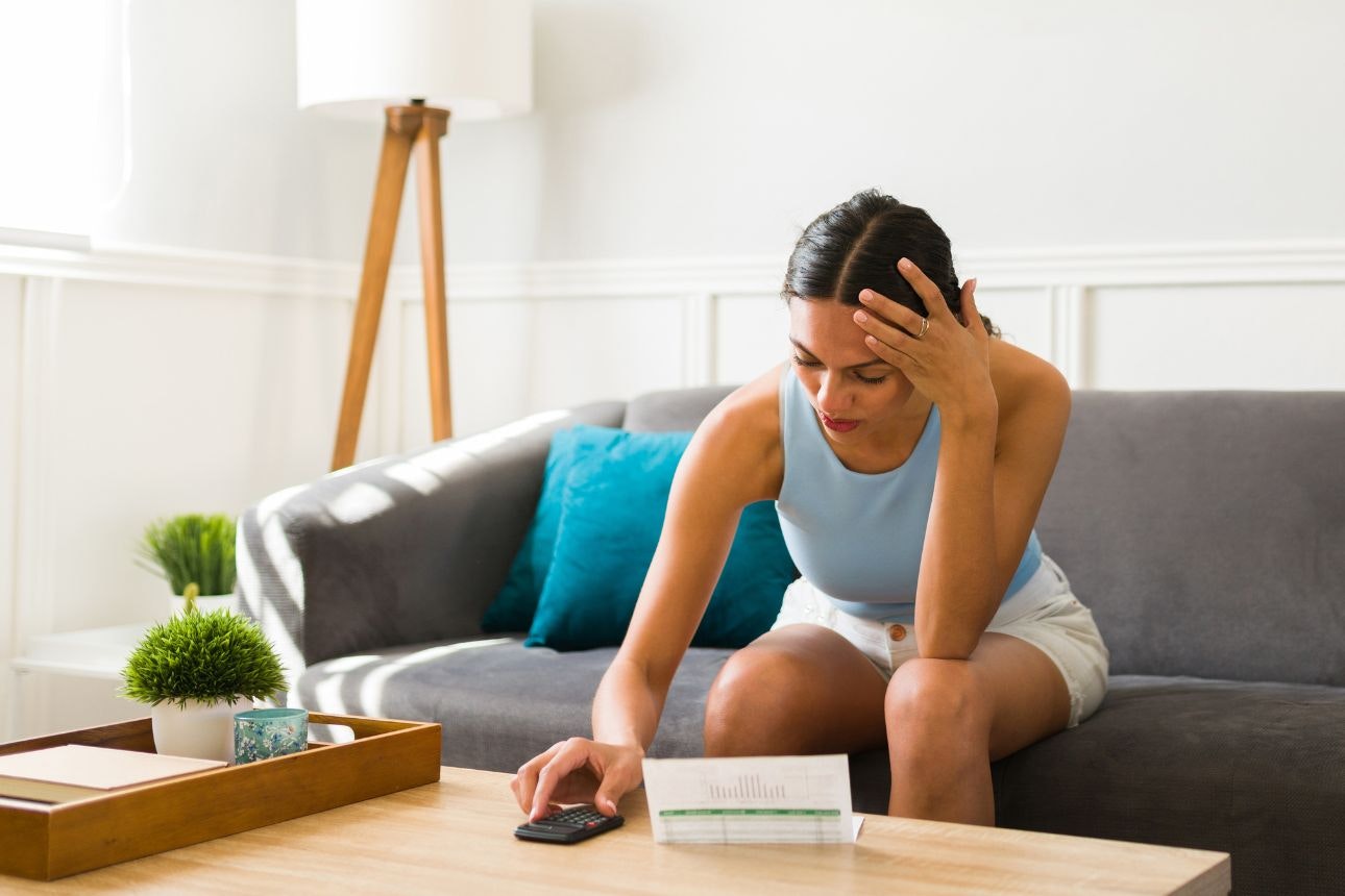 Image of a woman calculating her bills