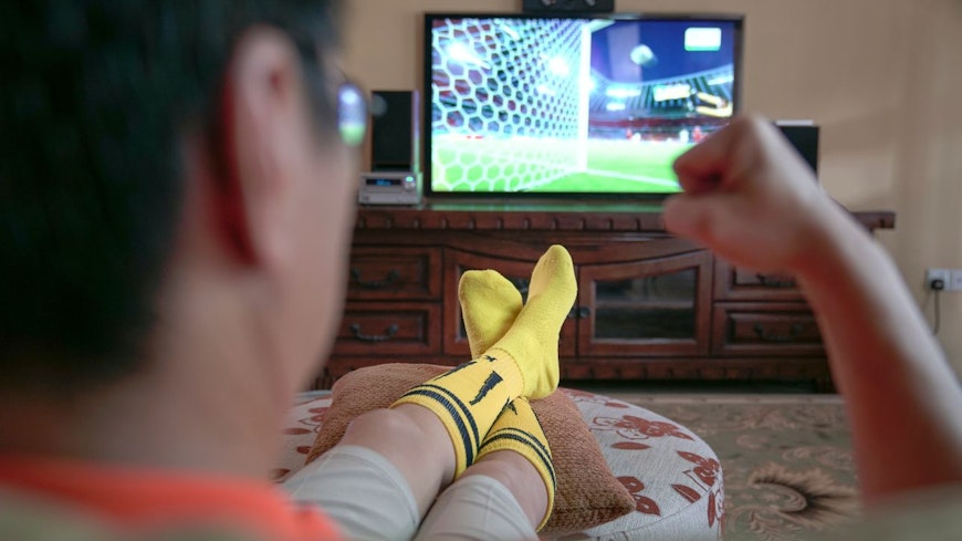 Image of a guy watching sport