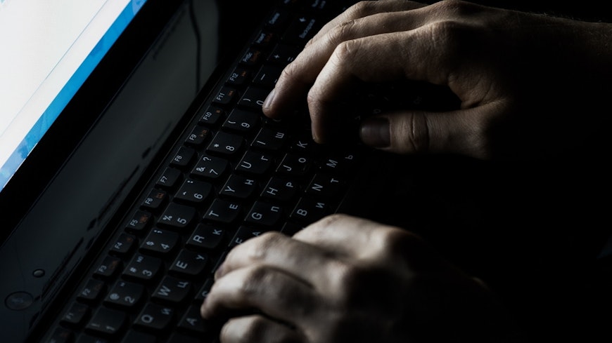 Image of hands typing on a keyboard