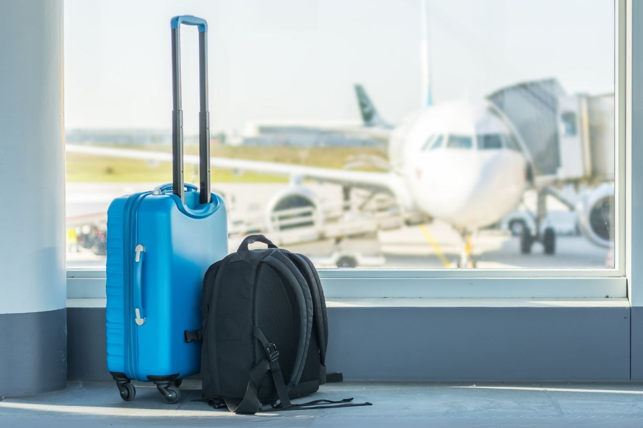 Image of luggage by an airport window