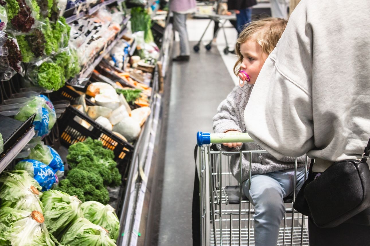 Image of a woman with her baby at the supermarket