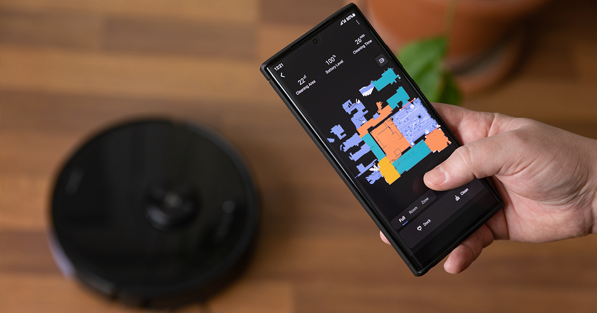 Image of person using a robot vacuum cleaner app to map their house.