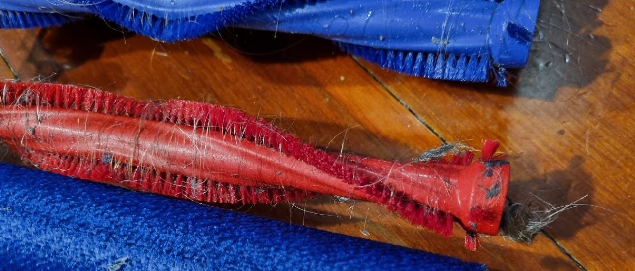 Tangled hair and dirt around the head rollers