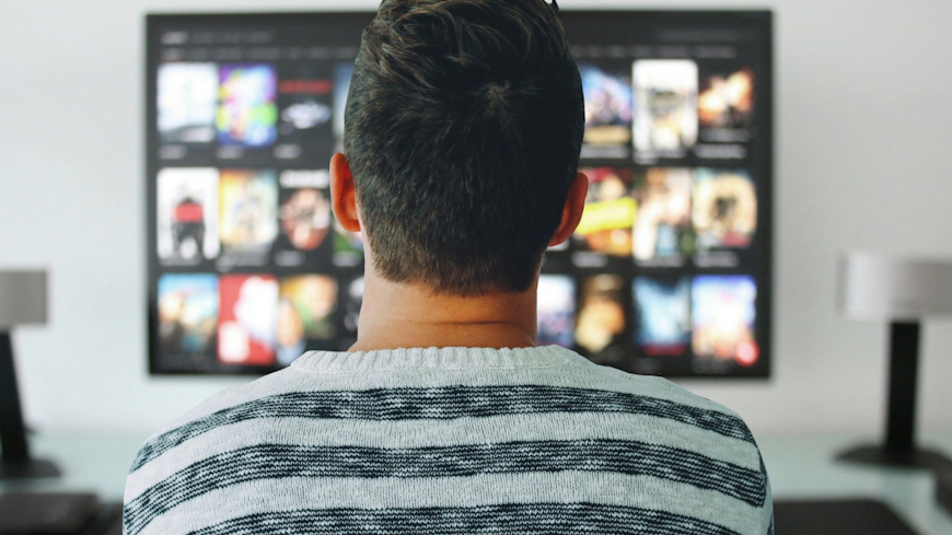 Image of a man watching TV