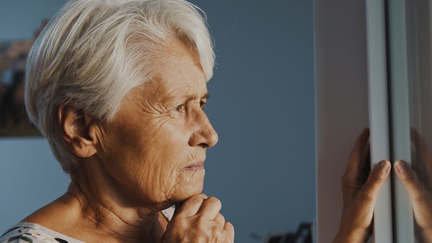 Image of a woman looking out the window