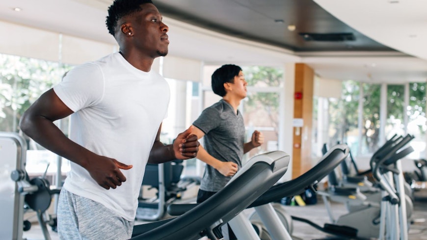 Image of men running on a treadmill