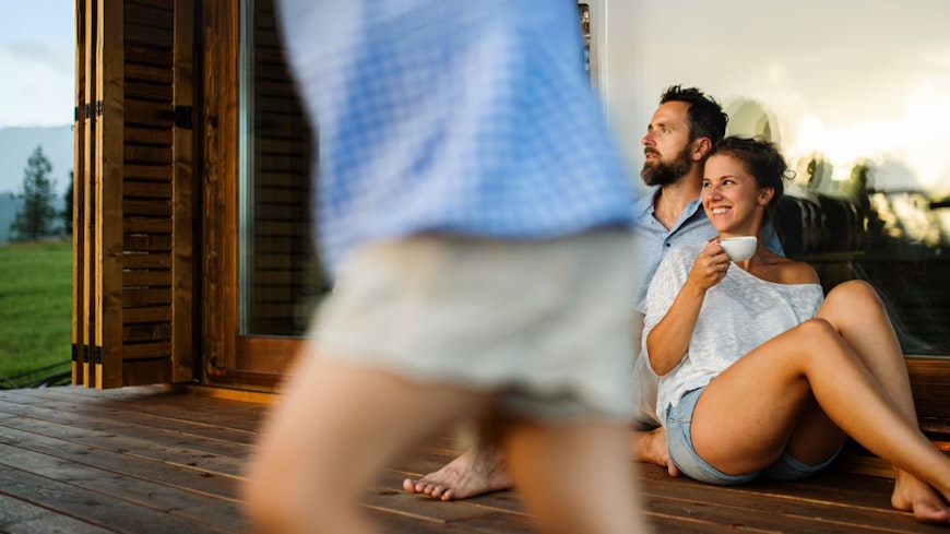 Family sitting outside the house