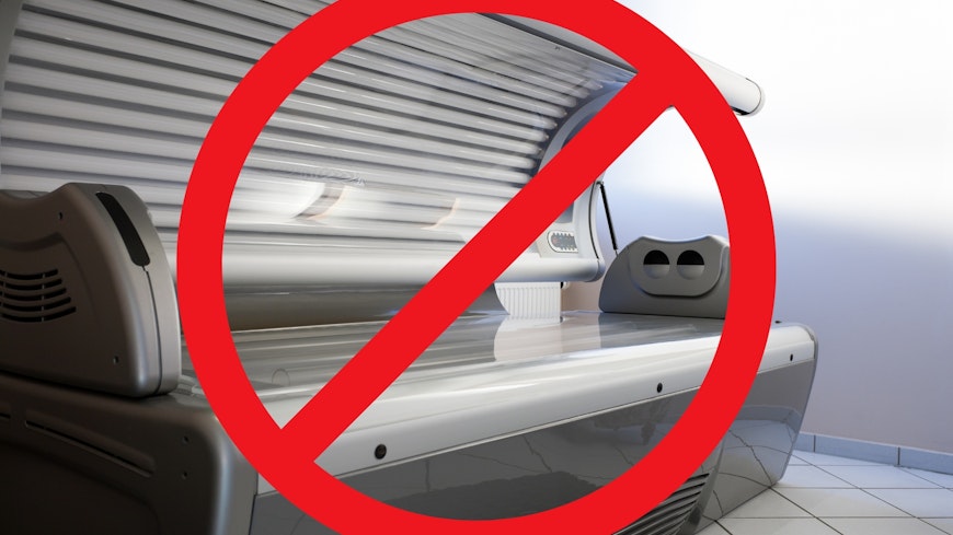Sunbed with a prohibited symbol on it.