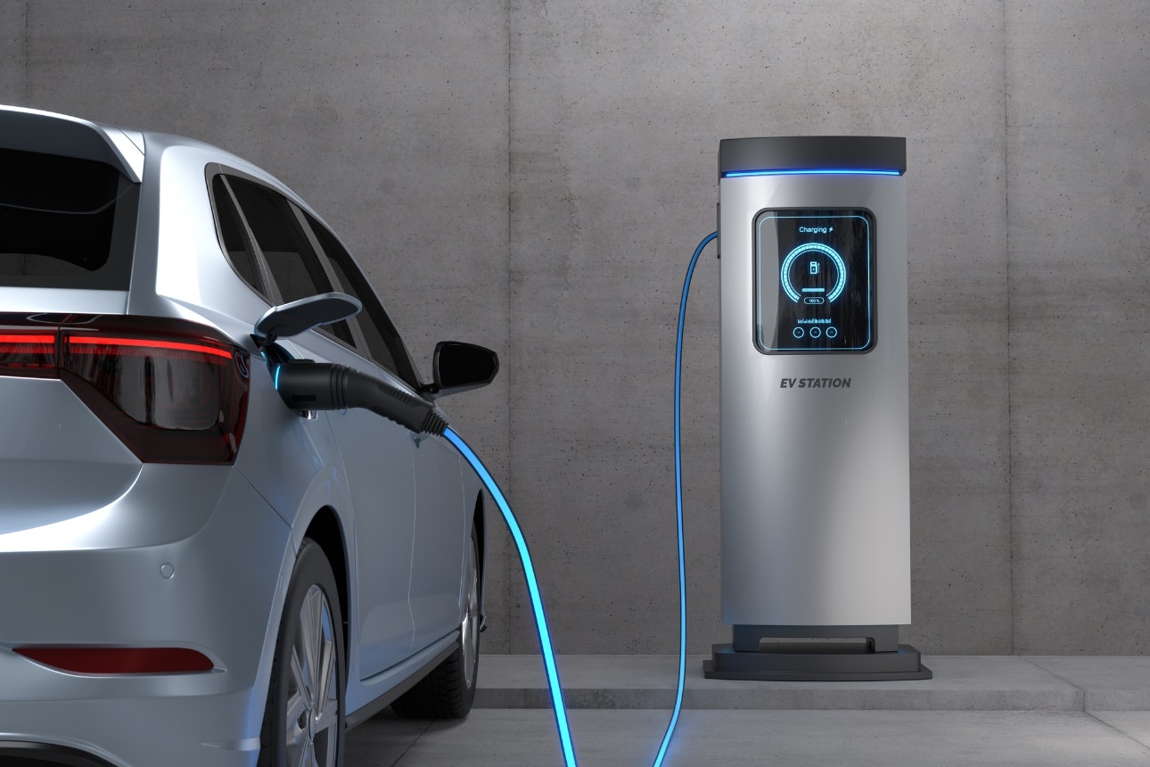 Electric vehicle charging at a charging station.